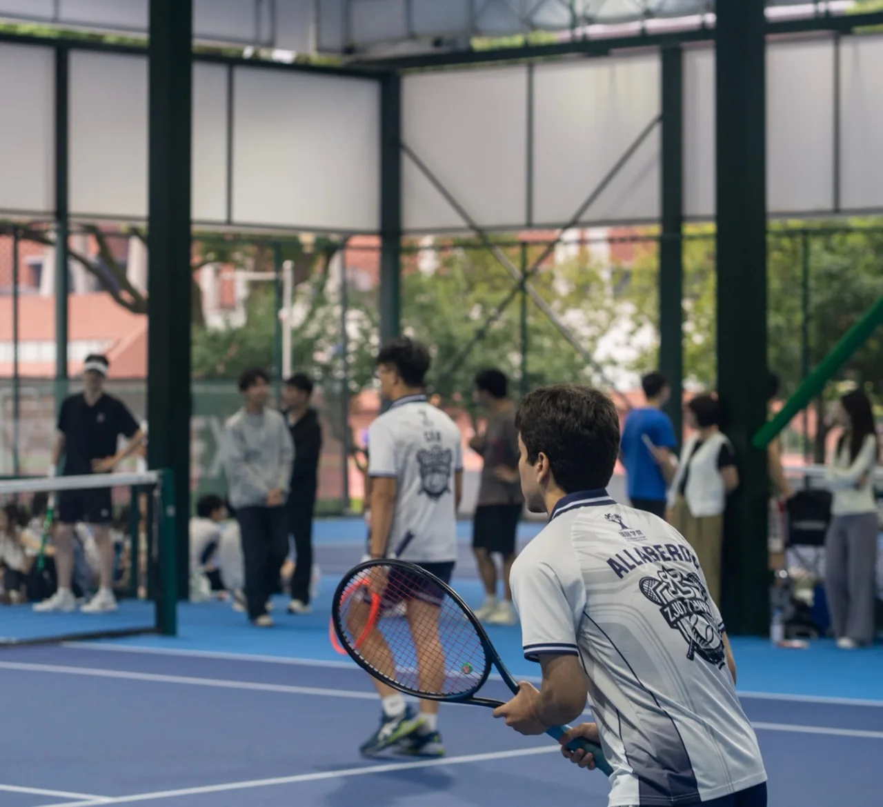 ZJUT tennis player wearing the finished polo during a match